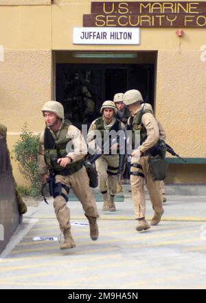 SGT David M. Simons, USMC, leads his team out of the Marine Security Forces Company during a React Drill. These Marines are part of the Interim Marine Corps Security Forces Company, Naval Support Activity, Bahrain. Base: US Naval Support Activity State: Juffair Country: Bahrain (BHR) Stock Photo