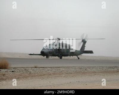 A US Army UH-60 Black Hawk prepares to lift off from Kandahar International Airport. Black Hawks are used for security operations in and around Kandahar, the city and airport. Subject Operation/Series: ENDURING FREEDOM Base: Kandahar International Airport Country: Afghanistan (AFG) Stock Photo