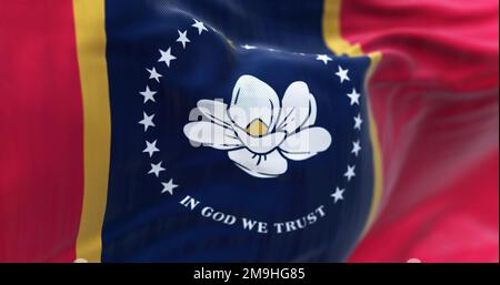 Detail of the Mississippi flag waving. White magnolia, 21 stars, In God We Trust, blue pale, gold borders, red field. Rippled fabric. Stock Photo