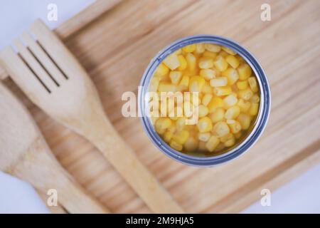 preserved sweet corm in a tin container on table  Stock Photo