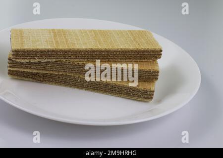 Several waffles on a white plate. Stock Photo