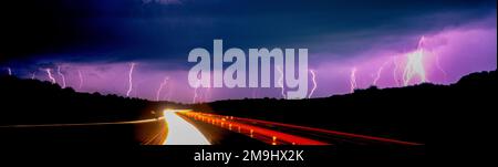 Lighting storm over I 94 highway Stock Photo