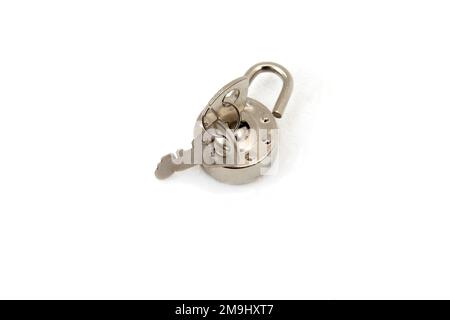 Small metal Circular Padlock and Two Keys Stock Photo