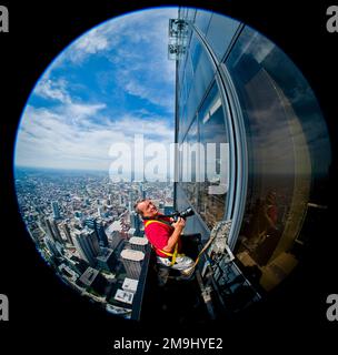Man with camera on Willis Tower, Chicago, Illinois, USA Stock Photo