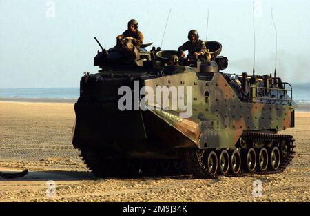 US Marine Corps (USMC) members with Landing Force Cooperation Afloat Readiness and Training (CARAT), guide their Assault Amphibian Vehicle (AAV7A1) on a Malaysian beach. Country: Malaysia (MYS) Stock Photo