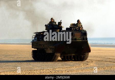 US Marine Corps (USMC) members with Landing Force Cooperation Afloat Readiness and Training (CARAT), guide their Assault Amphibian Vehicle (AAV7A1) on a Malaysian beach. Country: Malaysia (MYS) Stock Photo