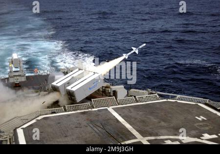 A North Atlantic Treaty Organization (NATO) RIM-7M Sea Sparrow radar-guided, air-to-air missile is fired from the Mk 29 Guided Missile Launching System (GMLS) onboard the US Navy (USN) SPRUANCE CLASS: DESTROYER, USS FIFE (DD 991) during the Pacific Phase of Exercise UNITAS 43-03. UNITAS (Latin for 'unity') involves warships from six countries participating in ten days of intense war games designed to build multinational coalitions while promoting hemispheric defense and mutual cooperation. Subject Operation/Series: UNITAS 43-03 Base: Uss Fife (DD 991) Stock Photo