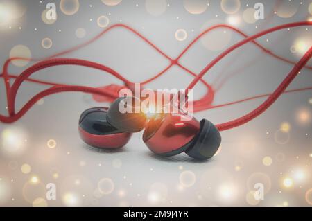 Red headphones placed on a white background Stock Photo