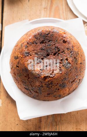 Christmas pudding. Irish boiled cake with cranberries, raisins and prunes. Stock Photo