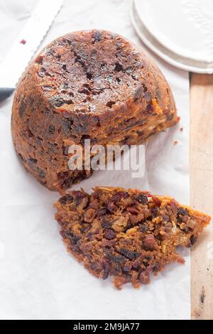 Christmas pudding. Irish boiled cake with cranberries, raisins and prunes. Stock Photo