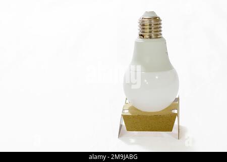 led light bulb in cardboard, on white background Stock Photo