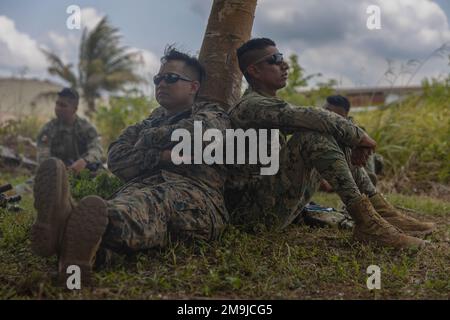 U.S. Marine Corps Staff Sgt. Jose Raynund-Hamoy, an infantry Marine with India Company, 3rd Battalion, 25th Marine Regiment, 4th Marine Division, takes an operational pause alongside a Mexican Marine during exercise Tradewinds 2022 (TW22) at Belmopan, Belize, on May 19, 2022. TW22 is a U.S. Southern Command-sponsored Caribbean-focused multi-dimensional exercise conducted in the ground, air, sea, and cyber domains, designed to provide participating nations opportunities to conduct joint, combined, and interagency training focused on increasing regional cooperation and interoperability in comple Stock Photo