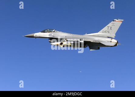 A US Air Force (USAF) F-16C Fighting Falcon aircraft from the 457th Fighter Squadron (FS), 136th Air Wing (AW), Texas (TX), Air National Guard (ANG), flies over Northwest Florida (FL), during exercise Combat Hammer, an air-to-ground Weapons System Evaluation Program (WSEP), hosted by the 86th Fighter Weapons Squadron located at Eglin Air Force Base, FL. The aircraft is armed with a GBU-24 2,000-pound laser guided bomb, and AIM-9 Sidewinder missiles. (Duplicate image, see also DFSD0413277 or search 021107F7531S001). State: Florida (FL) Country: United States Of America (USA) Stock Photo