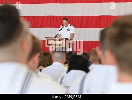 220519-N-UJ449-1218 NAVAL AIR STATION SIGONELLA, Italy (May 19, 2022)— Cmdr. James Donchez, Patrol Squadron (VP) 9 commanding officer, gives a speech during a change of command ceremony on Naval Air Station Sigonella, May 19, 2022. NAS Sigonella’s strategic location enables U.S., allied, and partner nation forces to deploy and respond as required, ensuring security and stability in Europe, Africa and Central Command. Stock Photo