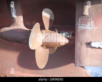 Rusty propeller of an old sea rescue ship in the evening light at Burg