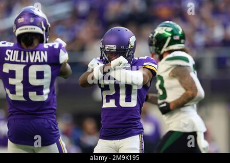 Minnesota Vikings cornerback Duke Shelley (20) greets safety Harrison Smith  (22) during the first half of