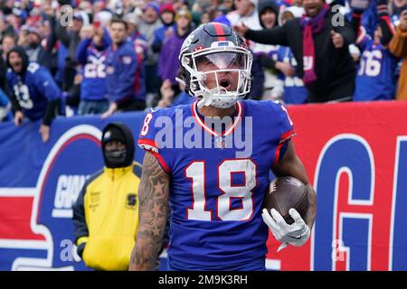 New York Giants wide receiver Isaiah Hodgins (18) runs with the ball  against the Washington Commanders during an NFL football game Sunday, Dec.  4, 2022, in East Rutherford, N.J. (AP Photo/Adam Hunger