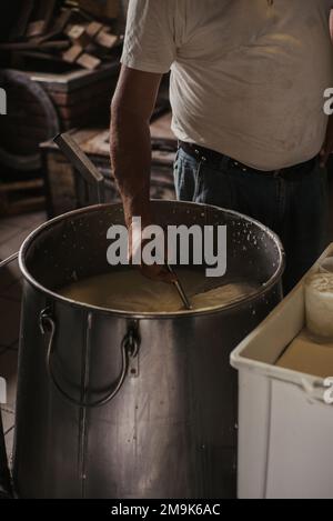 Making of ricotta cheese in a traditional way in Sicily Stock Photo