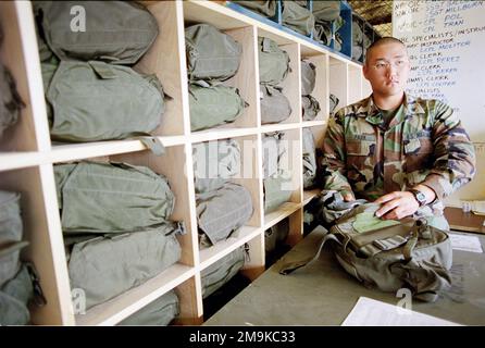 US Marine Corps Reserve (USMCR) Lance Corporal (LCPL) Park, assigned to A/Company, 4th Light Armored Reconnaissance Battalion (LAR), receives his gas mask during Nuclear, Biological, Chemical (NBC) training in preparation for mobilization at Camp Pendleton, California (CA), in support of Operation ENDURING FREEDOM. Base: Marine Corps Base Camp Pendleton State: California (CA) Country: United States Of America (USA) Stock Photo