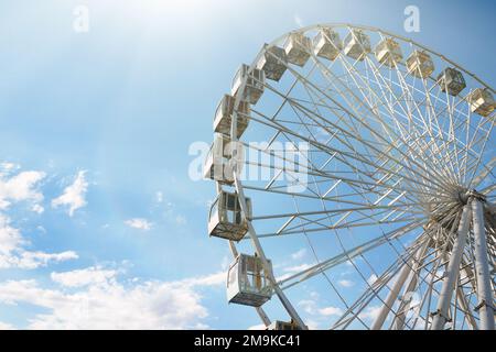 A wheel of review is in the park of entertainments, on a background ...