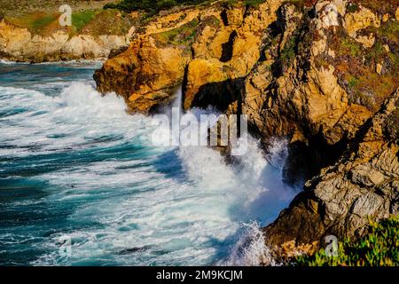 Waves crashing on rocky coast, Big Sur, Monterey County, California, USA Stock Photo