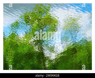 Abstract photograph of ripples and reflections of green trees in water Stock Photo