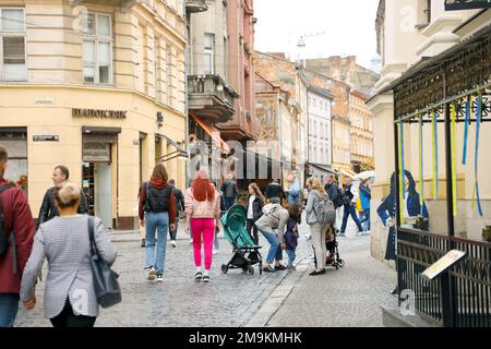 LVIV, UKRAINE - SEPTEMBER 11, 2022 Street view of the historical old city in Lviv, Ukraine. Many old buildings and facade ornaments in tight european style streets of Lviv Stock Photo