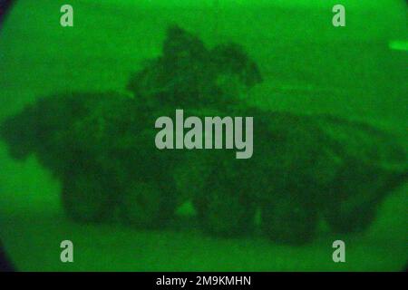 Nightscope view of a US Marine Corps (USMC) Light Armored Vehicle-25 (LAV-25) with the 1ST Light Armored Reconnaissance Battalion, 1ST Marine Division, Camp Pendleton, California (CA), as it moves to set up a perimeter during an exercise at Camp Coyote in Northern Kuwait during Operation ENDURING FREEDOM. (Substandard image). Base: Camp Coyote Country: Kuwait (KWT) Stock Photo