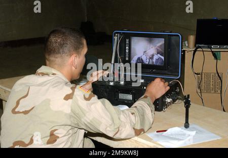 A US Army (USA) soldier assigned to 'C' Company, 27th Engineers Battalion, 82nd Airborne Division, operates the switch used to control the Mesa Associates' Tactical Integrated Light-Force Deployment Assembly (MATILDA), during a training session at Bagram Airbase, during Operation ENDURING FREEDOM. Subject Operation/Series: ENDURING FREEDOM Base: Bagram Air Base State: Parwan Country: Afghanistan (AFG) Stock Photo