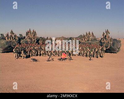 US Marine Corps (USMC) Marines of Echo Company (CO) 2nd Battalion 5th Marines, First Platoon, Marine Corps Base (MCB) Camp Pendleton, California (CA), stand for a photo before crossing the Iraqi border during Operation ENDURING FREEDOM. (Substandard image). Country: Kuwait (KWT) Stock Photo