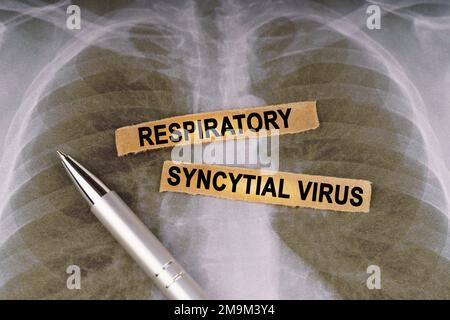 Medical concept. On a human chest x-ray, a pen and strips of paper labeled - respiratory syncytial virus Stock Photo