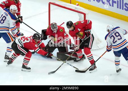 Chicago Blackhawks' Colin Blackwell (43) collides with St. Louis Blues  goaltender Jordan Binnington as Tyler Tucker (75) tries to clear the puck  during the second period of an NHL hockey preseason game