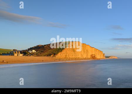 West Bay, Bridport, Dorset, UK. 18th Jan, 2023. UK Weather: The beach at the seaside resort of West Bay was closed today following a large landslip. A large pile of rocks could be seen on the beach leaving a scar in the cliff face made famous by the TV drama series Broadchurch. The honeycombe coloured rocks along this part of the Jurassic coast are known locally as being dangerous and prone to coastal erosion. Credit: Celia McMahon/Alamy Live News Stock Photo