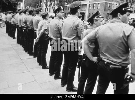 Black and white photograph of group of police officers standing on street side by side, New York City, USA Stock Photo