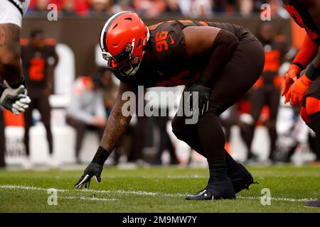 Cleveland Browns defensive tackle Jordan Elliott (90) reacts after