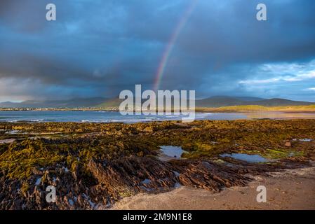 Atlantic Ocean, mountains, beaches, cloudy skies, rainbows, Dingle Peninsula on Ireland’s Wild Atlantic Way, southwest Atlantic coast Stock Photo