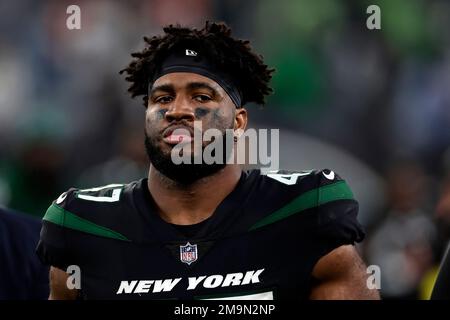 New York Jets defensive end Bryce Huff (47) walks off the field after an  NFL football