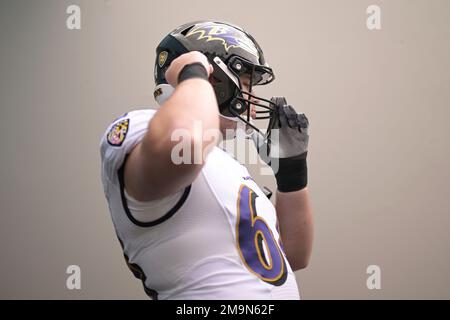 Baltimore Ravens center Tyler Linderbaum (64) signals during an