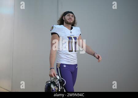 Baltimore Ravens punter Jordan Stout (11) runs off the field at