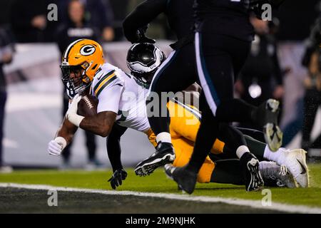 Miami. FL USA; Green Bay Packers running back AJ Dillon (28) is tripped up  while running with the ball short of the end zone during an NFL game again  Stock Photo - Alamy