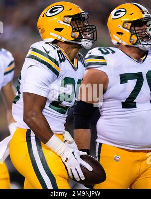 Santa Clara, CA, USA. 26th Sep, 2021. Green Bay Packers' AJ Dillon (28) is  tackled by San Francisco 49ers' Azeez Al-Shaair (51) and San Francisco 49ers'  Emmanuel Moseley (4) after a pass