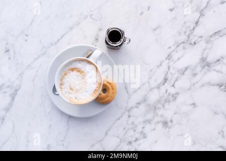 Cappuccino cup and biscotti top down view, italian coffee, cafe. Stock Photo