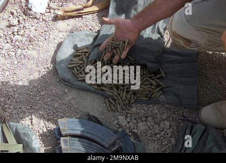 US Marine Corps (USMC) personnel assigned to the 24th Marine Expeditionary Unit (MEU), Special Operations Capable (SOC) display seized Iraqi ammunition, captured during a raid on an El Fedayeen Headquarters location in Iraq, during Operation IRAQI FREEDOM. Subject Operation/Series: IRAQI FREEDOM Country: Iraq (IRQ) Stock Photo