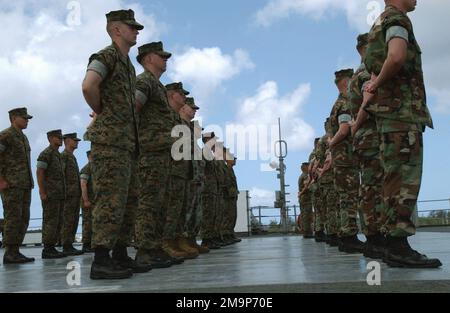 On board US Navy (USN) Amphibious Command Ship USS BLUE RIDGE (LCC 19), US Marine Corps (USMC) Marines of the 7th Fleet, Fleet Anti-Terrorist Security Team (FAST) stand ready to be inspected at US Naval Forces Marianas, Guam. The BLUE RIDGE is here to participate in Exercise TANDEM THRUST 2003. Base: US Naval Forces, Marianas State: Guam (GU) Country: Northern Mariana Islands (MNP) Stock Photo