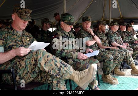 US Marine Corps (USMC) Major (MAJ) Scott Campbell (foreground), Commanding Officer, Task Force Georgia Train and Equip Program (GTEP), reviews his notes prior to the start of a Certification Ceremony, held at Rock City, Georgia. The ceremony marks the completion of the third tactical training phase, for Republic of Georgia Army Soldier from the 16th Mountain Battalion, participating in the program. GETEP is a phased training initiative that enhances operational capabilities of select Georgian units to increase security of Georgia's borders and promote stability within the region. Subject Opera Stock Photo
