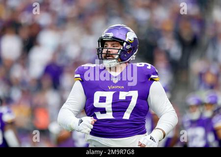 Minnesota Vikings defensive tackle Harrison Phillips (97) stands over the  football during a NFL football game against the Miami Dolphins, Sunday,  Oct.16, 2022 in Miami Gardens, Fla. (AP Photo/Alex Menendez Stock Photo 