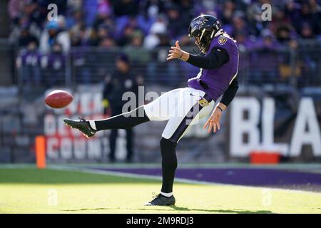 Baltimore Ravens punter Jordan Stout (11) follows through on a kick in the  first half of an NFL football game against the New England Patriots,  Sunday, Sept. 25, 2022, in Foxborough, Mass. (