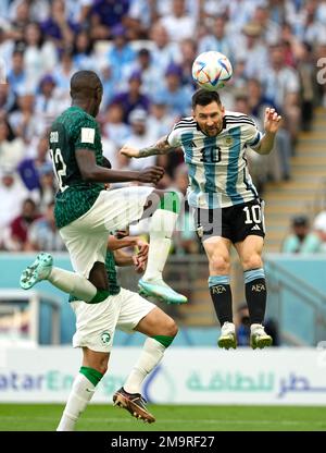 Argentina's Lionel Messi (right) And Saudi Arabia's Abdulellah Al-Malki ...