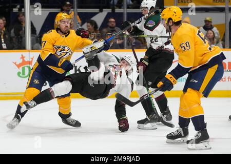 Boston Bruins' Trent Frederic (11) and Arizona Coyotes' Liam O'Brien (38)  fight during the second period of an NHL hockey game, Saturday, Oct. 15,  2022, in Boston. (AP Photo/Michael Dwyer Stock Photo - Alamy
