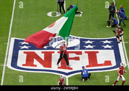 Arizona Cardinals guard Will Hernandez (76) wears a Mexico flag sticker on  his helmet prior to an NFL football game against the Carolina Panthers,  Sunday, Oct. 2, 2022, in Charlotte, N.C. (AP